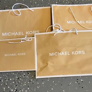 Michael Kors Gold Gift Bags with White Accents